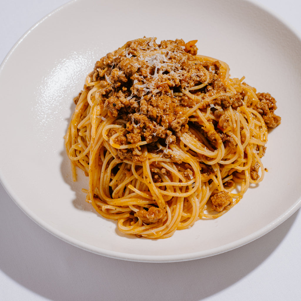 Greek style dry aged meat sauce 'kima', with spaghetti and graviera