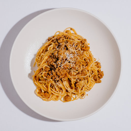 Greek style dry aged meat sauce 'kima', with spaghetti and graviera